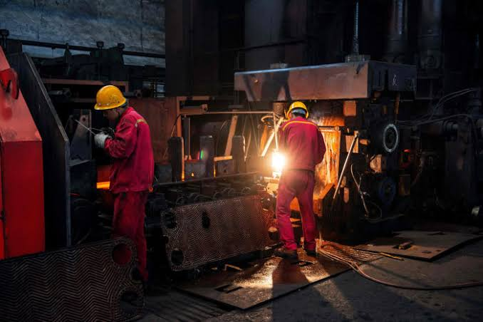 Factory floor with workers and machinery in China