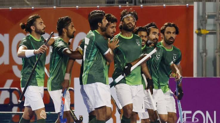 Hockey players contesting a aerial ball during an international match