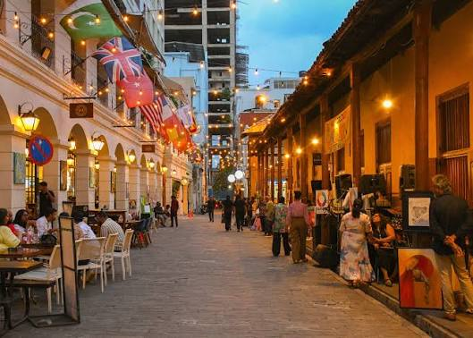 Crowd at a previous Fairway Street of Stories event in Colombo Fort, with a jazz band performing at dusk