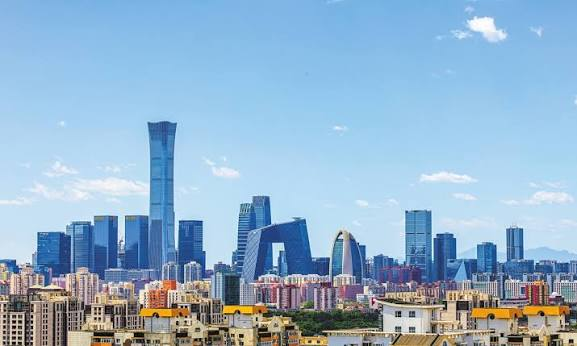 Beijing skyline with construction cranes and elevated rail