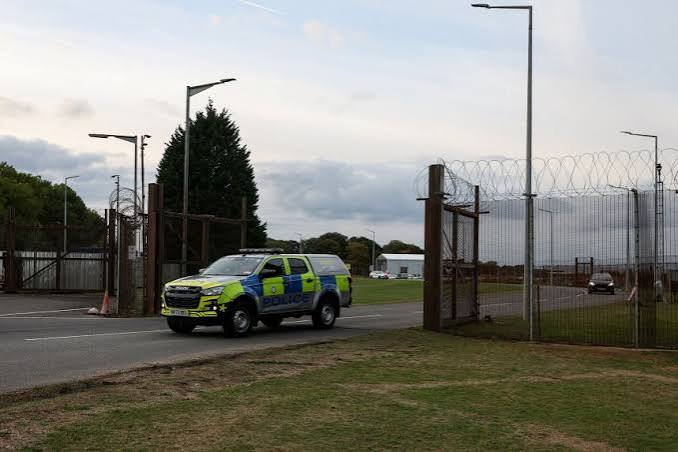 Perimeter fencing at RAF Molesworth with security signage