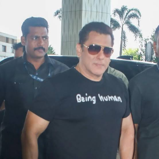 Salman Khan leaving a press venue with security personnel visible