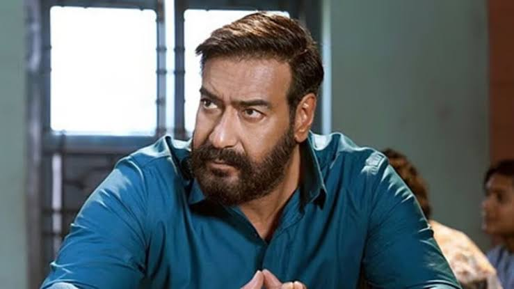 Crowded cinema lobby with Drishyam 3 posters and people queueing for tickets