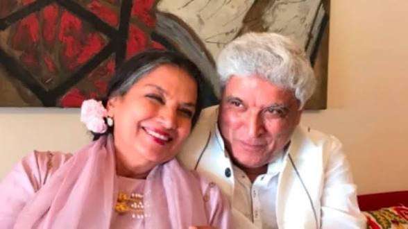 Black and white young Javed Akhtar at a railway station
