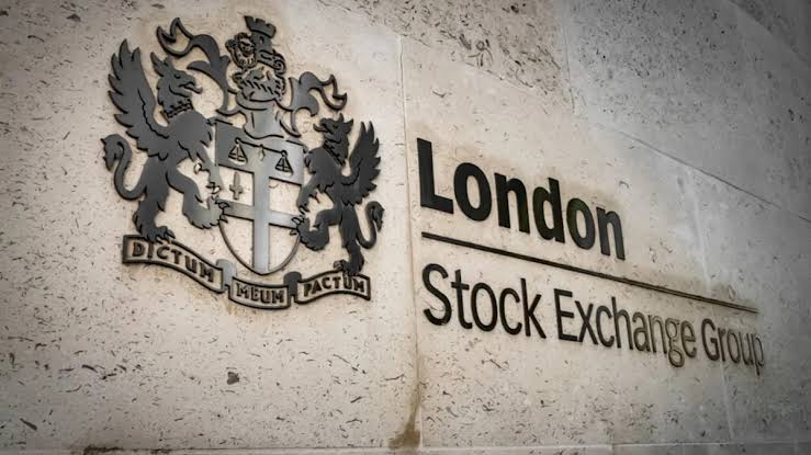 Exterior of London Stock Exchange building with ticker displays
