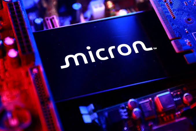 Micron logo on semiconductor wafer backdrop