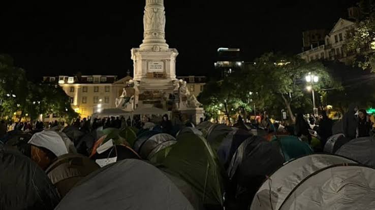 Protest tents and people in Rossio Square Lisbon during housing demonstrations