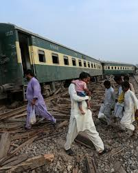 Rescue workers at the site of the Rehman Baba Express derailment near Multan