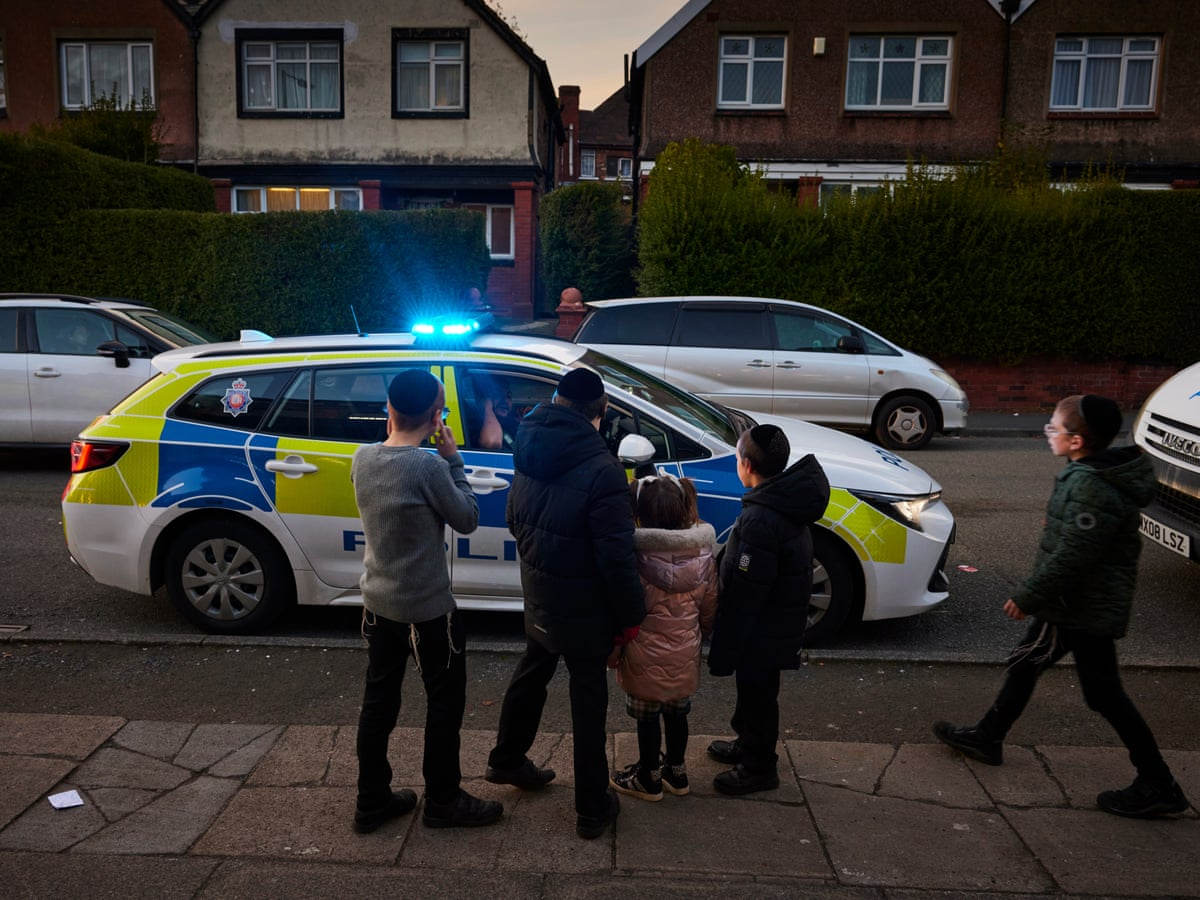 Police outside court entrance with vans and officers on duty