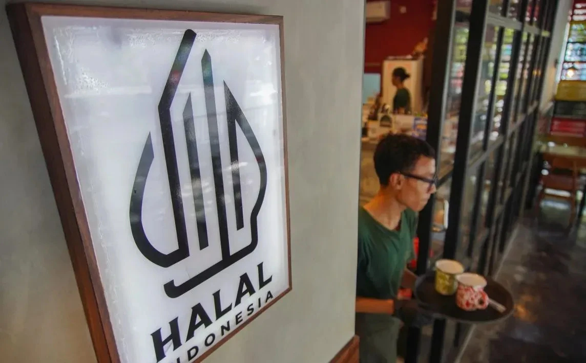 Small food producers in Indonesia prepare packaging while officials review certification documents