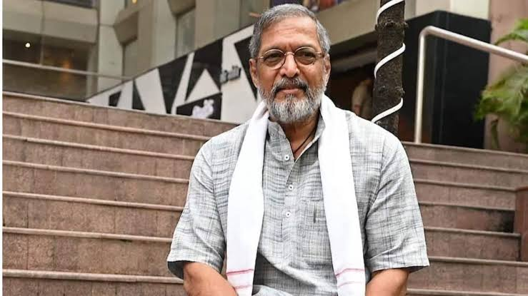 Nana Patekar at an award function, speaking into a microphone