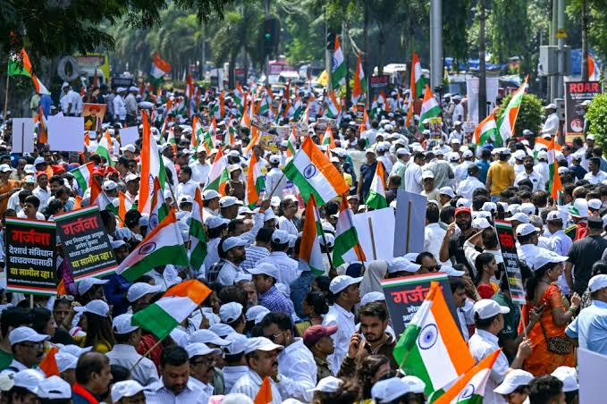 Protesters holding placards near Jantar Mantar in New Delhi during October 2026 demonstrations