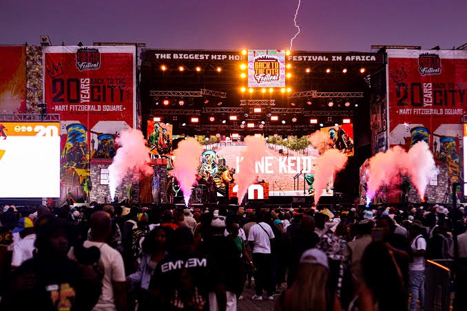 Crowd and stage at Back to the City festival in Newtown, Johannesburg, during rain