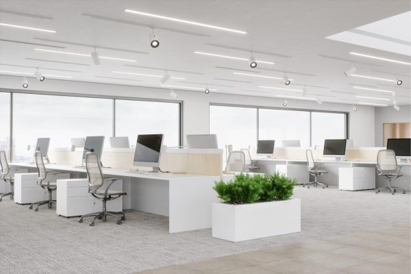 Interior of a flexible workspace centre with desks and people working