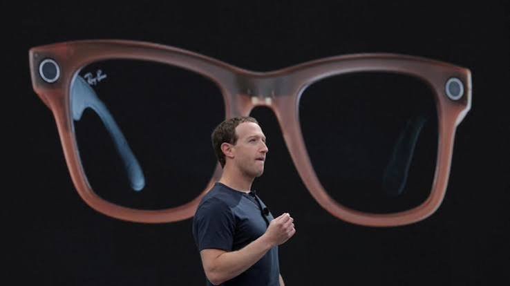 Person wearing smart glasses in public with a blurred background