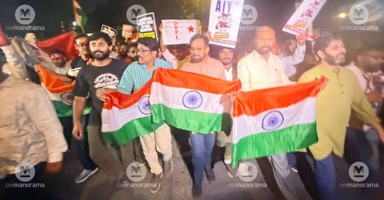 Police barricades and crowds near Connaught Place, New Delhi