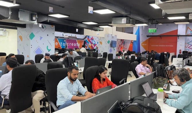 Women in a hackathon working with AI tools